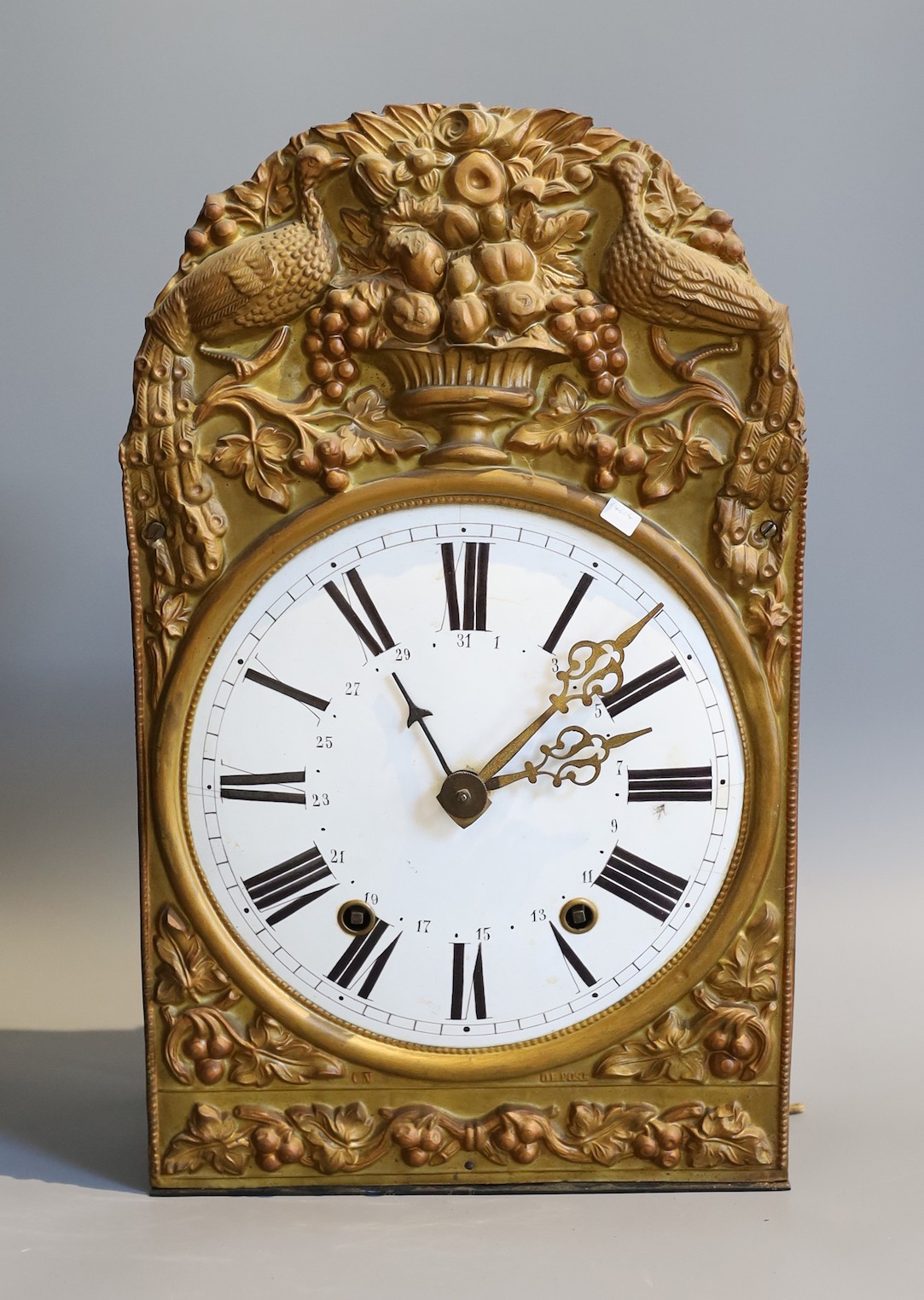 A 19th century French eight day longcase clock movement, with circular enamelled dial, pendulum and weights